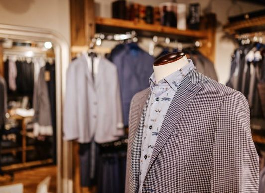 2021 04_Taylor&Co-Spring2-035 A mannequin with a brown blazer and a colourful dress shirt.